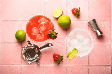 Margarita cocktails. Classic and strawberry margarita with tequila, ice and lime with ingredients at color background.