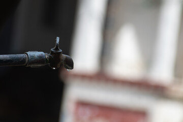 Picture of a tap on a hot sunny day showing drought like conditions. Hot, summer, water shortage, monsoon, temperature, heat wave, hydration, dehydration, water drop, iron, people, hope, dry, record