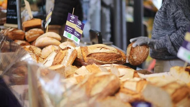 Freshly baked delicious white bread on farmer market in Paris, France.