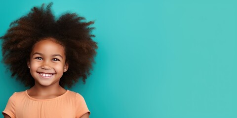 Aqua background Happy black american african child Portrait of young beautiful kid Isolated on Background ethnic diversity equality acceptance concept with copyspace