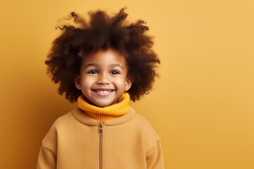 Beige background Happy black american african child Portrait of young beautiful kid Isolated on Background ethnic diversity equality acceptance concept with copyspace