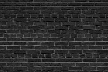 Old black brick wall. Abstract interior background.