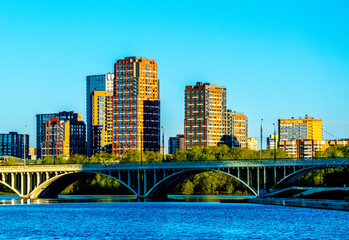 Urban residential buildings near the bridge over the river.