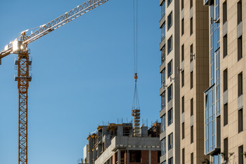 A tower crane lifts a lot of cargo at once.