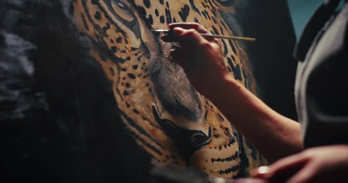 Artist Painting Portrait of a Jaguar
