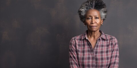 Cream background sad black American independent powerful Woman. Portrait of older mid-aged person beautiful bad mood expression girl Isolated on Background racism skin color depression anxiety 