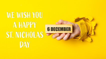 We wish you a happy 6th St. Nicholas Day written on a yellow background