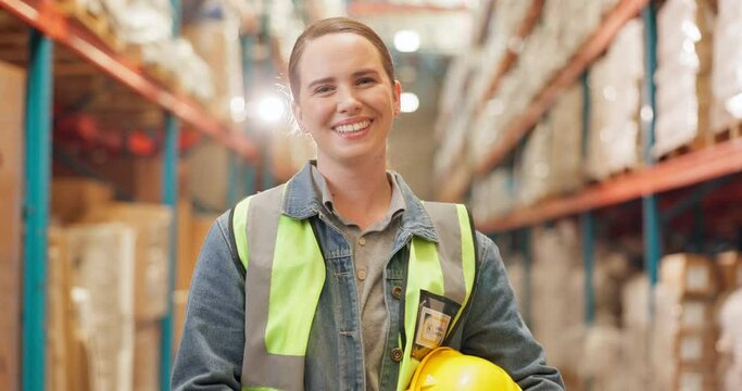 Logistics, woman and face in warehouse with helmet, smile and safety vest in supply chain or freight. Female person, industry and quality control in manufacturing, shipping or stock control in trade
