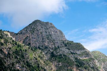 Clouds over the tops of the rocks. View of the Caucasus Mountains in Ingushetia, Russia