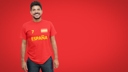 Handsome spanish football fan with beard and red jersey