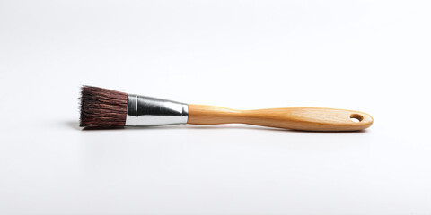 Fototapeta premium Wooden-Handled Brush for Construction and Household Tasks