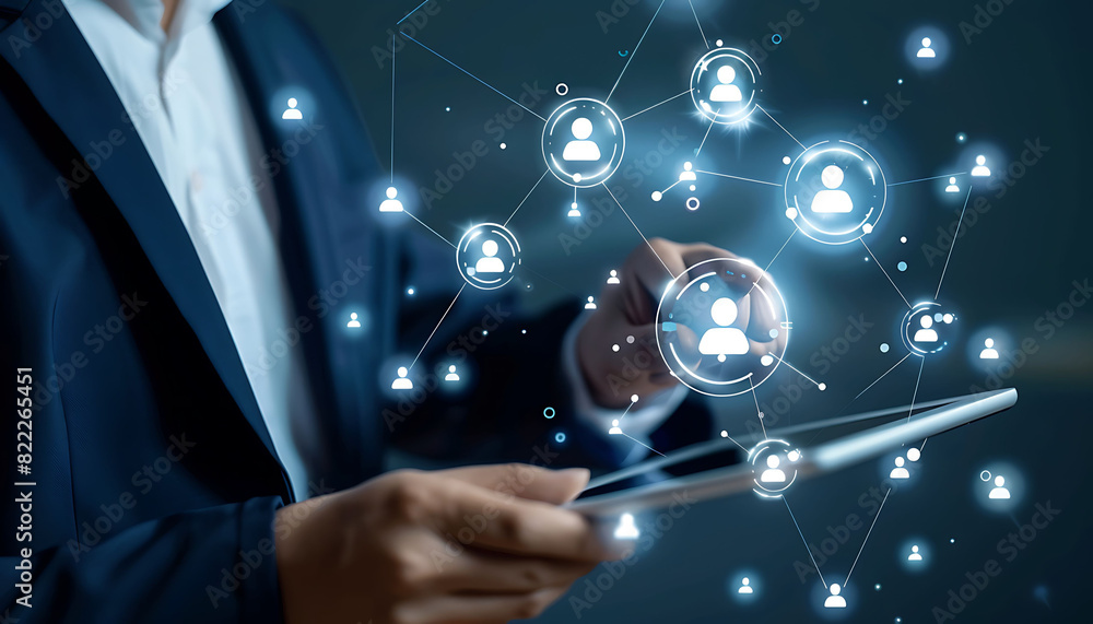 Poster a businessman using a digital tablet to engage with a virtual network of customer and hr icons, demo