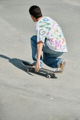 A young skater boy enjoys riding his skateboard down a steep cement ramp at an outdoor skate park...