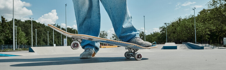 A young skater boy effortlessly rides his skateboard, performing tricks in the vibrant skate park...