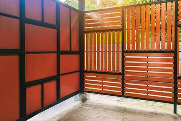  Wood lath wall decoration made by brown shera wood boards, vertical and horizontal slim lines...