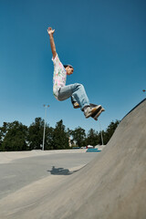 A young skater boy fearlessly rides a skateboard up the side of a ramp at a bustling outdoor skate...