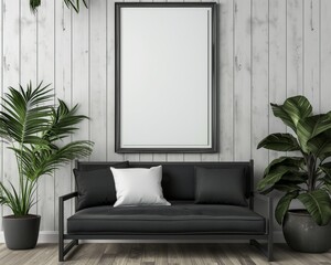 An empty white picture in a black frame hangs on a white wooden wall, a black sofa with pillows and two tall potted plants, minimal interior.