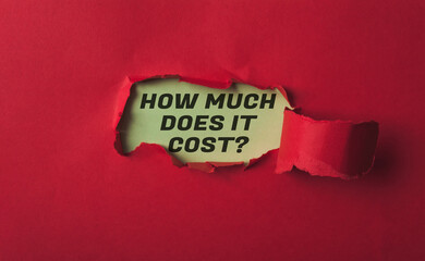 A red paper with the words How much does it cost written on it