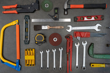 Old tools equipment on black table background, engineering concept