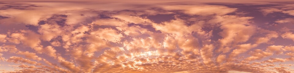 Sunset sky with bright glowing pink Cumulus clouds. Seamless spherical HDR 360 panorama. Full...