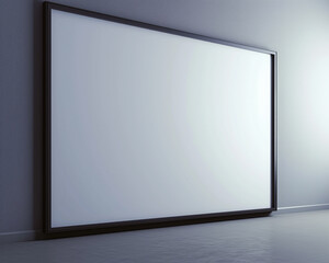A modern architectural studio features one large empty white frame with dark borders, spotlighted against a light gray wall. 