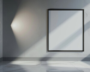 An architectural firm's reception area with a single empty white frame with dark borders, spotlighted and angled downward against 