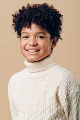 charming portrait of a young african american girl in a white turtleneck sweater against a soft beige background