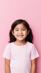 Pink background Happy Asian child Portrait of young beautiful Smiling child good mood Isolated on backdrop ethnic diversity equality acceptance 