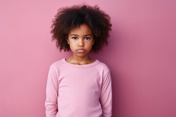 Pink background sad black American African child Portrait of young beautiful kid Isolated Background racism skin color depression anxiety fear burn out 