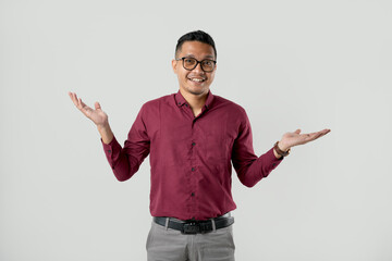 A handsome young Asian man in a suit wearing glasses and making various facial expressions isolated on a white background