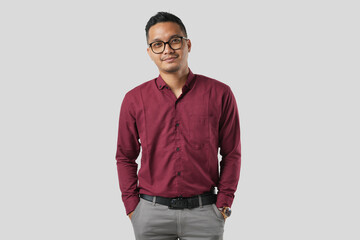 A handsome young Asian man in a suit wearing glasses and making various facial expressions isolated on a white background