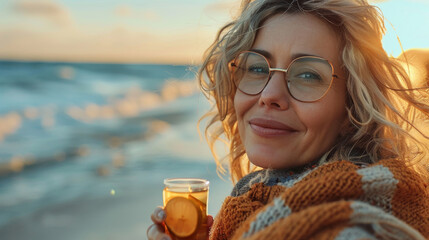 Smiling Woman Holding Drink Outdoors in Autumn Beach. Generative ai
