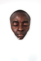 Face, relax and black person in milk bath for smooth, clean and hydrated body care routine. Calm, health and African male person wash in water with dairy liquid for soft skin, spa or soak treatment.