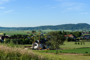 A beautiful spring landscape of a field against a background of mountains 