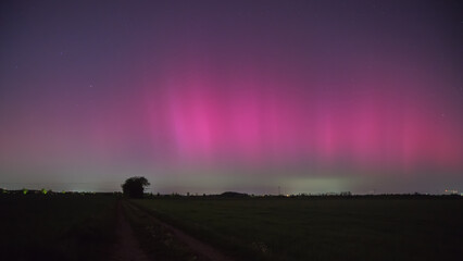 Northern lights over Munich due to an extreme geomagnetic storm on the night of May 10th to 11th,...