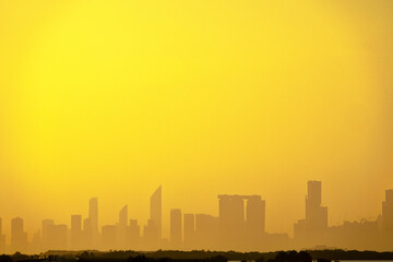 Sandstorm, samum, haboob over the southern megalopolis, the outline of skyscrapers are drowning in...