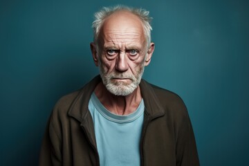 Teal background sad european white man grandfather realistic person portrait older person beautiful bad mood old man Isolated on Background 