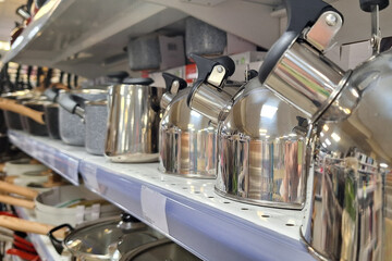 Pots and Pans Lined Up on Shelf