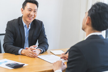 Business finance concept, teamwork and partnership asian businessman customer and salesman discussing client, hand sign sales contract with document at desk office. Lawyers working together at meeting