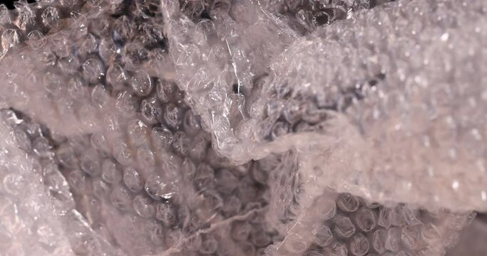 old air cellophane with a lot of bubbles for safe storage of things, close-up of a protective film with air bubbles
