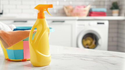 Liquid detergent bottle on a white counter top, laundry basket and washing machine in the background, blurred background, copy space. Home cleaning concept.