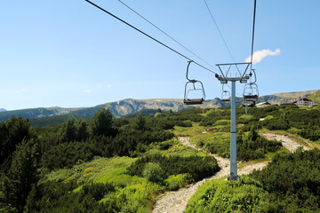 On the chairlift, lift up to the plateau of the Seven Rila Lakes in the Rila National Park, the lift station and the Rila Lakes Chalet can be seen at the top, close to Sofia, Bulgaria