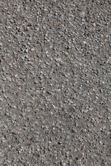 Gray gravel pathway, crushed stone texture background, vertical