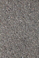 Gray gravel pathway, crushed stone texture background, vertical