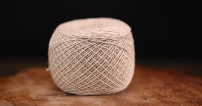 fine cotton thread for knitting and embroidery, close-up of a ball of light-colored thread for needlework