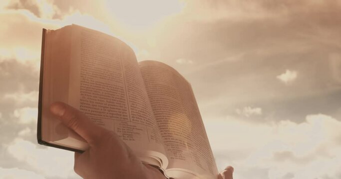 Female Hands Opening And Reading A Bible