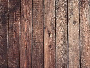 A wooden background with a few spots of paint