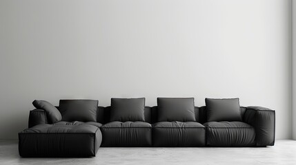 The Monochrome Relaxation: Black Couch Against White Wall