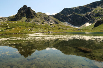 The mountains reflecting on the smooth surface of the Fish Lake, Ribnoto Ezero, one of the Seven...