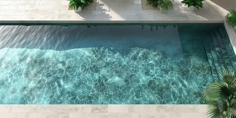 Aerial perspective of a swimming pool surrounded by lush greenery